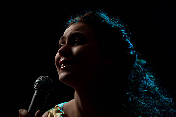 istock Woman singing in microphone 158412463