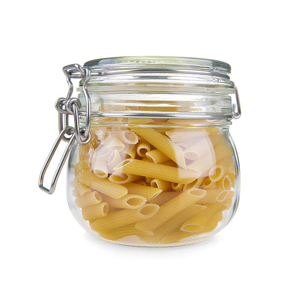 istock Macaroni in glass jar on a white background 158416981
