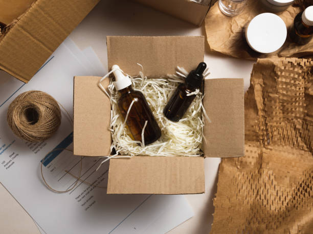 istock Beauty box with serum bottles on shredded white paper 1584201420