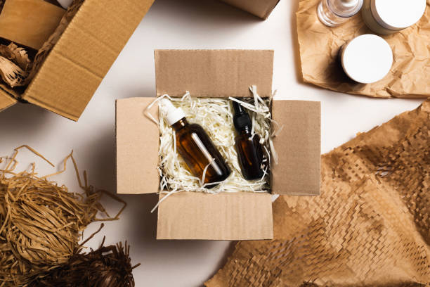 istock Beauty box with serum bottles on shredded white paper 1584201424