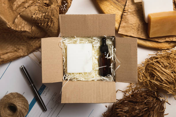 istock Beauty box with serum bottles on shredded white paper 1584201435