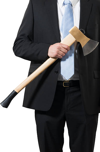istock businessman carrying an axe to do the chopping 158421500