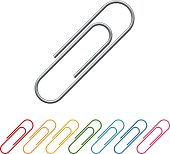 Rainbow of paper clips in a row with large paper clip on top