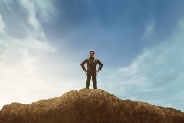istock Business man looking on top mountain 3d illustration 1584281325