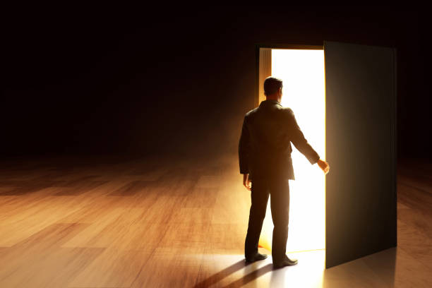 istock Business man opening book at library 3d illustration 1584288871