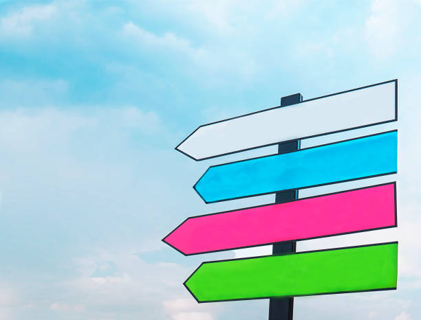 istock Colorful blank street direction sign with blue sky background 1584292065