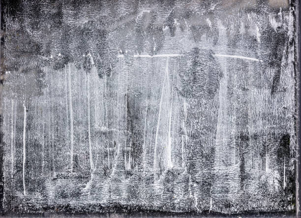 istock hand painted whitewashed glass surface of greenhouse windows. abstract background. 1584295184