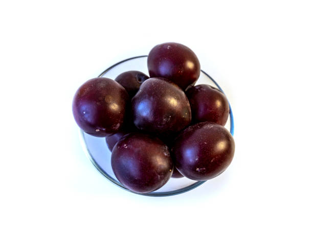 istock photo of plum on a plate, isolate 1584304221