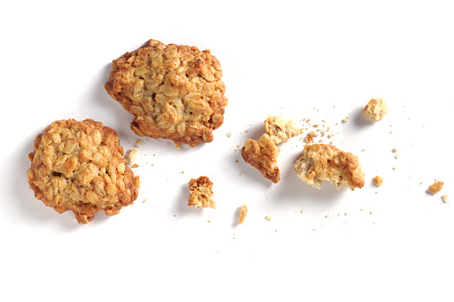 Homemade oatmeal cookies on white background close-up, top view