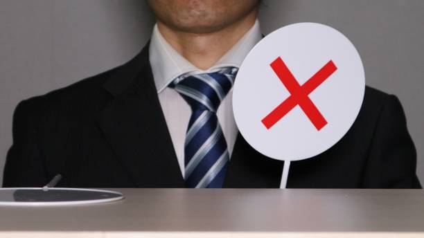 istock Cross stick and businessman 1584330503