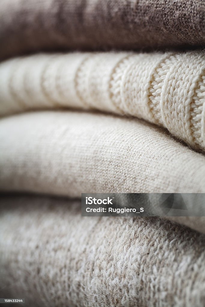 wool sweater winter stack of colorful winter woolen sweaters Art And Craft Stock Photo