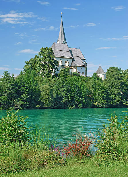 Maria Woerth,Woerthersee,Austria the famous Church of Maria Woerth at Woerthersee,Carinthia,Austria maria woerth stock pictures, royalty-free photos & images