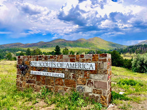 Cimarron, New Mexico, USA - July 24, 2023: A sign welcomes visitors to one of the gates along the northern perimeter of the Boy Scouts of America’s Philmont Scout Ranch in northern New Mexico.