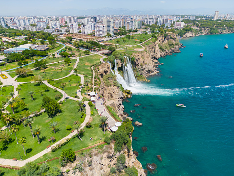Aerial view of Duden waterfall dropping in Mediterranean Sea in Antalya, Lara Antalya in a bright sunny day, Lower Duden Waterfalls,  the waterfall in the city falls into the sea, Turkey's famous tourism destination in Antalya.