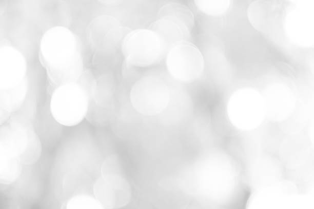 istock Gray white light bokeh background is a shiny naturally grey occurring shadow that is not clear but beautiful. 1584357498