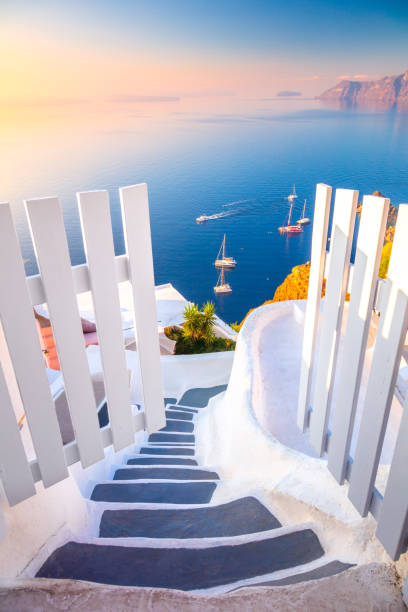 Open Gate to Paradise. Santorini, Greece. White architecture, open doors and steps to the blue sea of Santorini, Oia stock photo