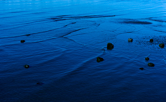 Pale moonlight reflected on the surface of the sea with copy space.