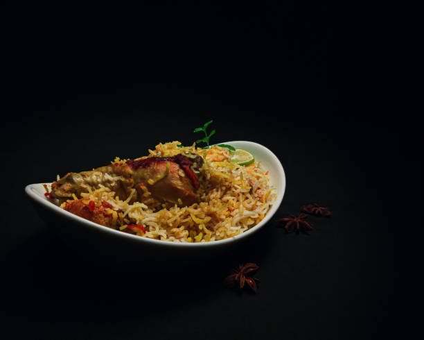 istock Traditional chicken biryani on dark background 1584391002