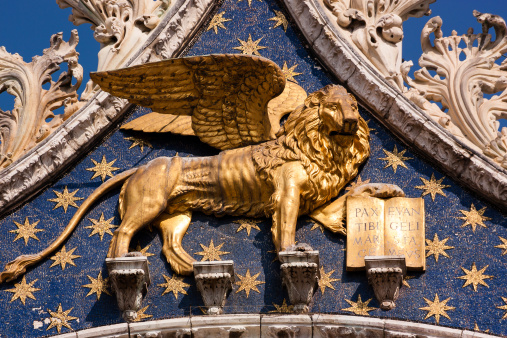 One of the large Golden Lions of St Mark in St Marks Square, Venice, Italy