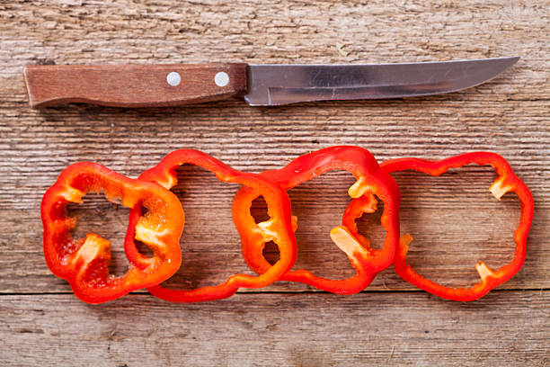 istock sliced red bell peppers and old knife 158446035