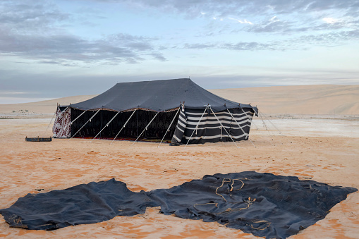 Doha, Qatar - December 10, 2022: Tent in the desert, south inland sea of Doha, Qatar