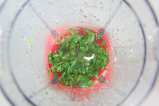 pepper mint leaf in the food processor view from above