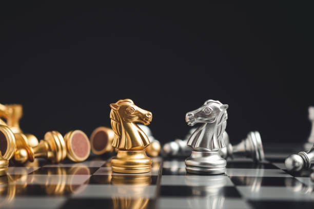 istock Chess game on a chessboard. Chess is a symbol of leadership, struggle, victory, strategy, and business concept 1584477191