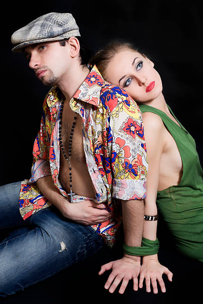 istock Young man and woman sitting on the floor 158456583
