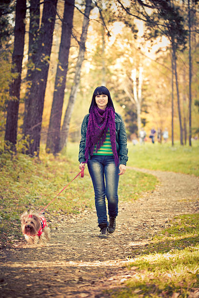 istock woman in autumn park 158457326