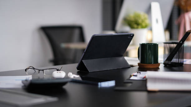 istock Bright modern workplace with laptop computer and office supplies. 1584603357