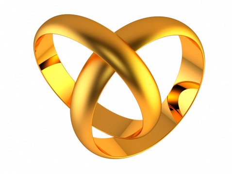 Two golden wedding rings isolated on white. 
