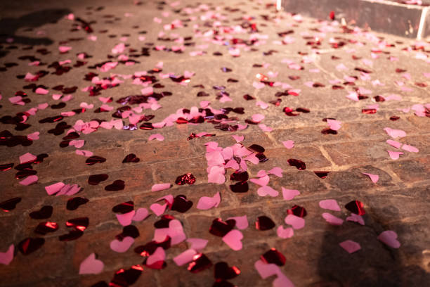 istock Pink glittering decoration hearts on a floor 1584659273