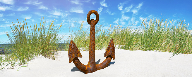 Summer Vacation Concept. Silver Nautical Anchor on an Ocean Deserted Coast extreme closeup. 3d Rendering