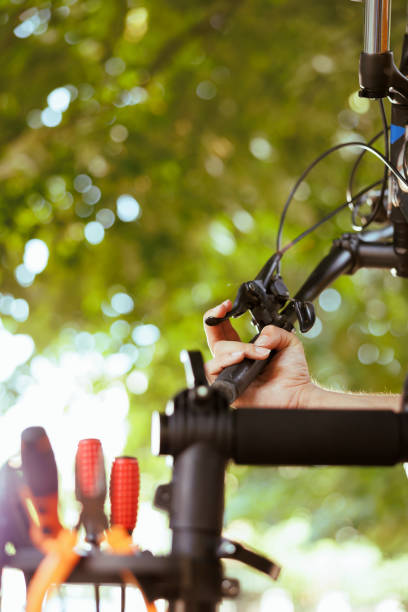 istock Person maintaining bicycle parts in yard 1584684036