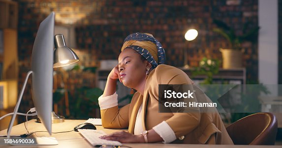 istock Tired, sleeping and business woman on computer and night fatigue, time management or mental health. Professional african person or employee with depression, career dream or online deadline in office 1584690036