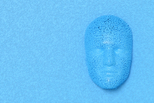 Artificial Intelligence, Deep Learning, Technology Background.  Dissolving Human Face with Cube Shaped Particles. Digitally generated image.