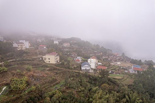 A bird's-eye view of the village in the fog