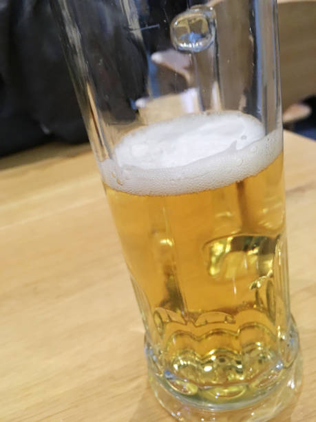 istock German cold beer with foam on wood table in Frankfurt 1584695924