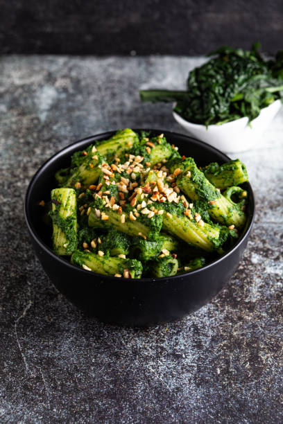 istock Pasta with black cabbage pesto and chopped hazelnuts 1584714783