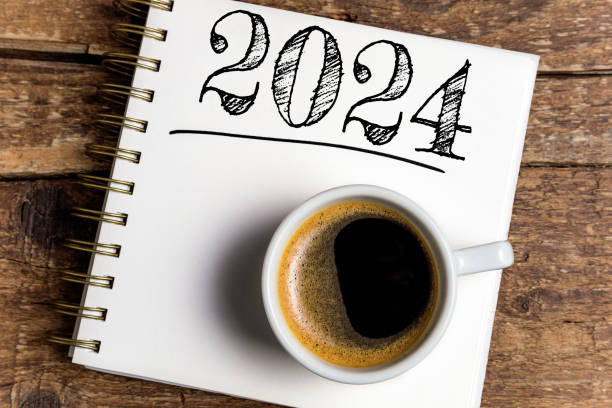 istock New year resolutions 2024 on desk. 2024 resolutions list with notebook, coffee cup on table. Goals, resolutions, plan, action, checklist concept. New Year 2024 template 1584728882