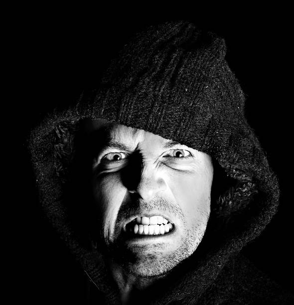 istock Hooded Angry man gritting his teeth 158475417