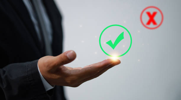 istock Right, and wrong icons with men's hand choosing the right icon. Approving, voting, or right decision concept. 1584766163