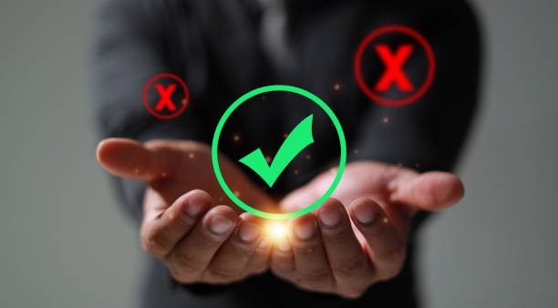 istock Right, and wrong icons with men's hand choosing the right icon. Approving, voting, or right decision concept. 1584766169