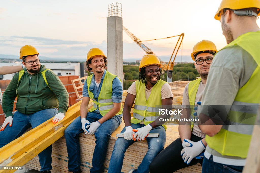 Construction Workers Taking A Break After Working On A Construction ...
