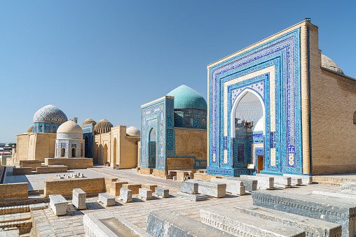 Awesome view of the Shah-i-Zinda Ensemble in Samarkand, Uzbekistan. Mausoleums decorated by blue tiles with designs. The necropolis is a popular tourist attraction of Central Asia.