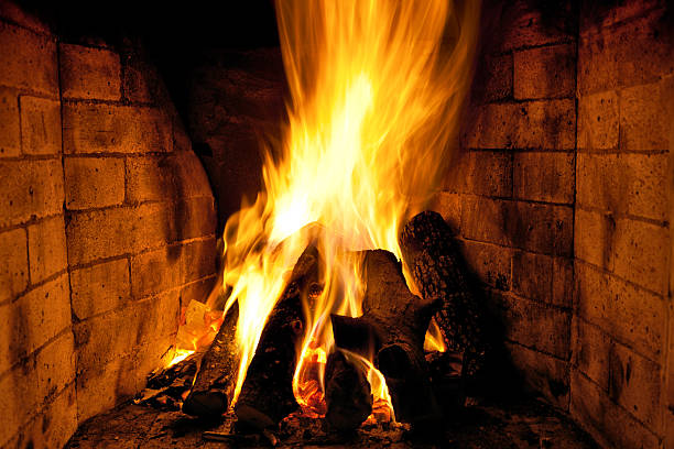 istock bright flame of fire in the fireplace 158478555