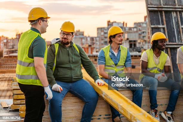 Construction Workers Taking A Break After Working On A Construction ...