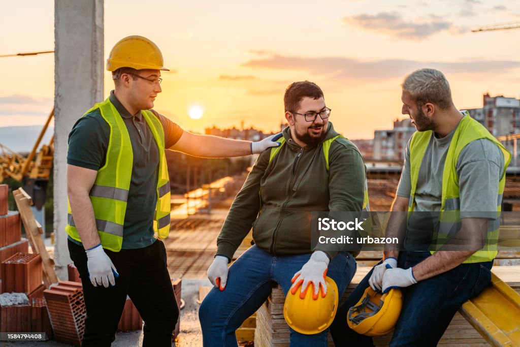 Construction Workers Taking A Break After Working On A Construction ...