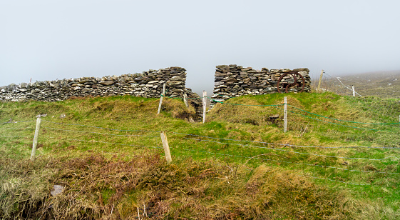 Impression with stone wall around the Dingle Peninsula in Ireland