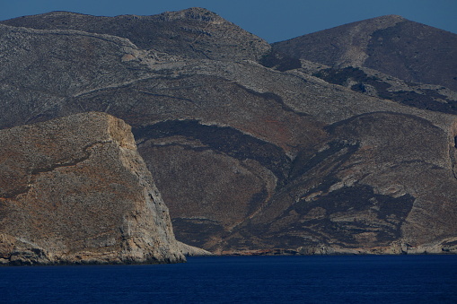 Arid coast, leaving the island of Syros, Cyclades